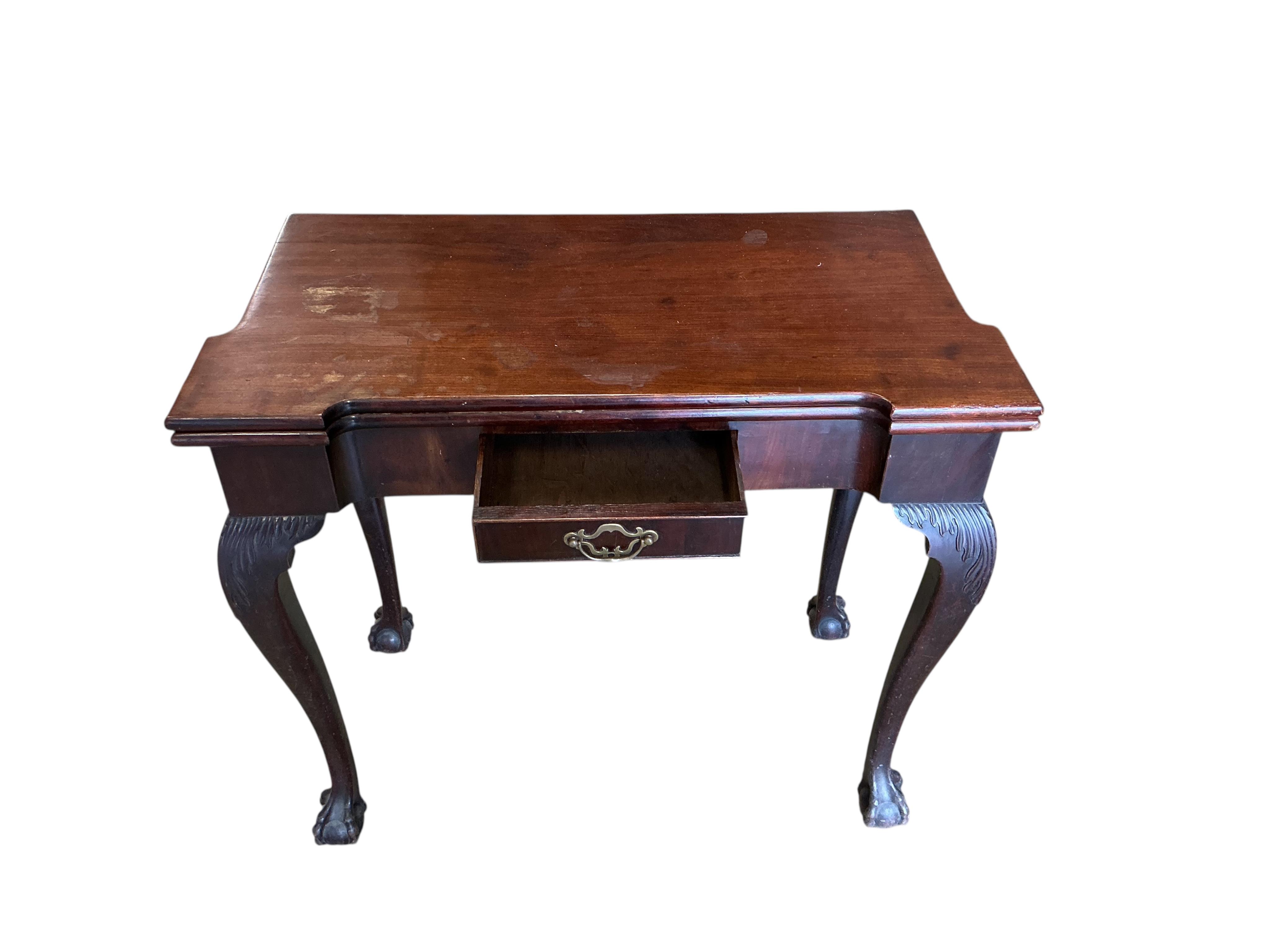 An 18th century rectangular mahogany folding tea table, width 80cm, depth 40cm, height 72cm